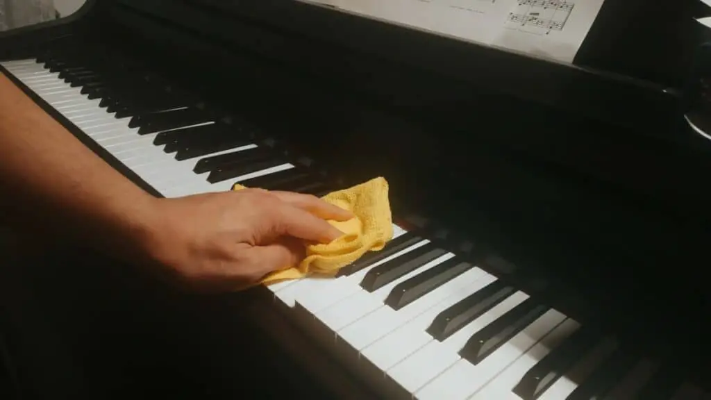 wiping the keys with microfiber cloth