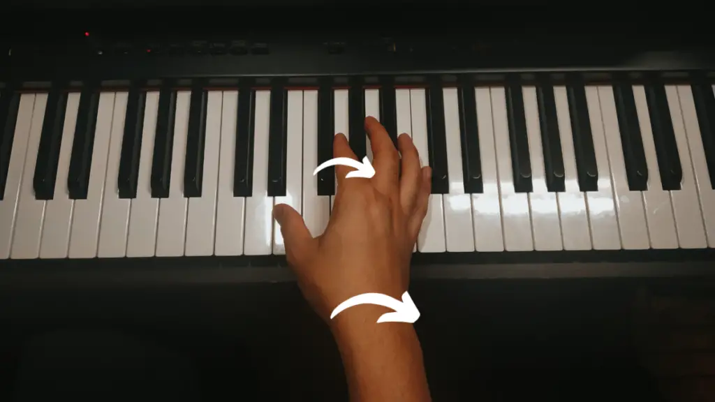 Picture of a hand on a piano