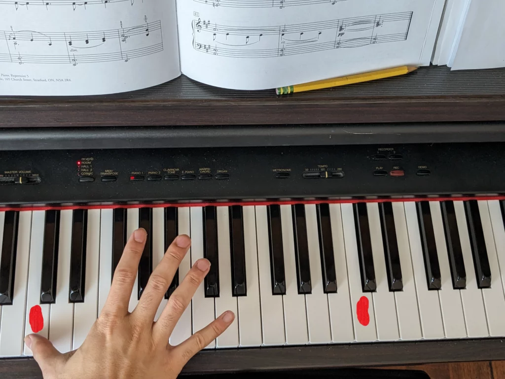 hand moving on the piano