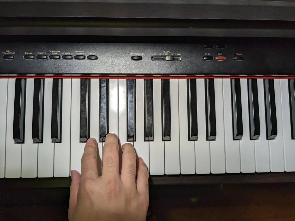 fingers on a piano